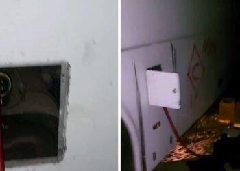 בחסות הלילה: בוזזים את האוטובוסים שנפגעו במתקפת הטילים. צילום דוברות המשטרה